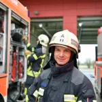 portrait of a firefighter in the operations centre at the fire-fighting vehicle Bildbeschreibung